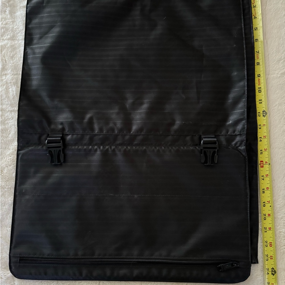 TUMI removable black garment sleeve with rod for luggage